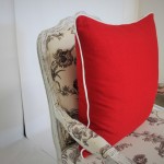 Red Pillow with White Piping