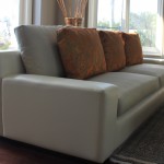 Custom sofa in vinyl body and linen cushions